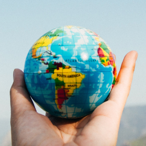 Hain hand holding earth